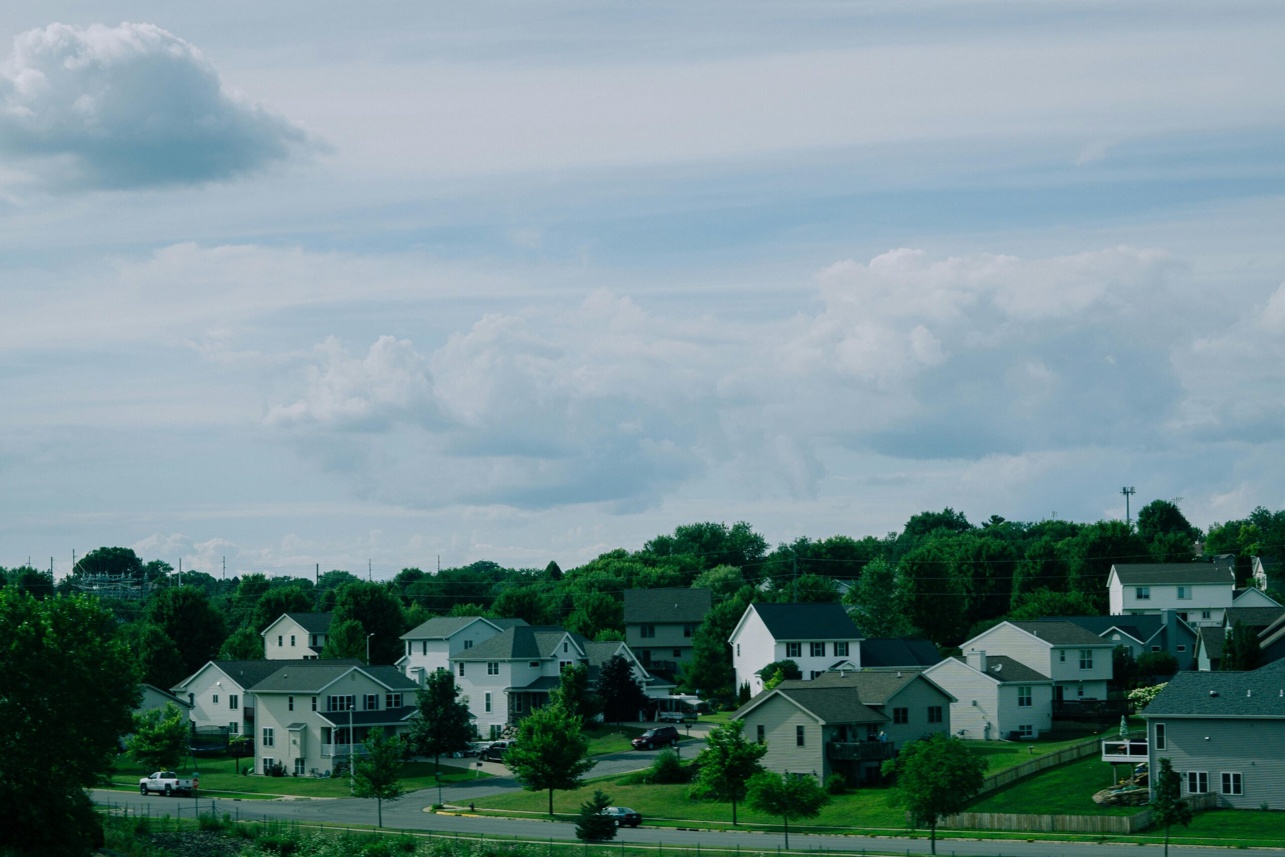 Suburban neighborhood under dramatic sky